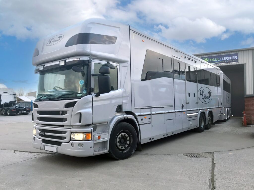 Front angle view of Oatley Scania horsebox wrapped in gloss grey for HK Horses.